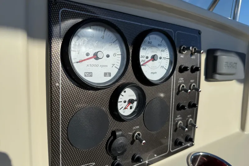 Slide: The Image of Dashboard of a 2016 Pioneer 180 Islander boat with gauges and switches. - 17