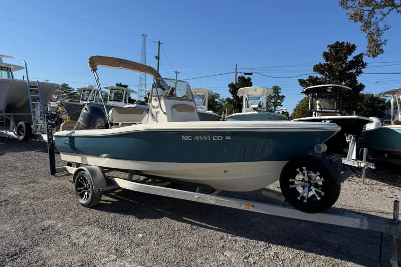 The Image of 2016 Pioneer 180 Islander boat on trailer in outdoor lot. - 2
