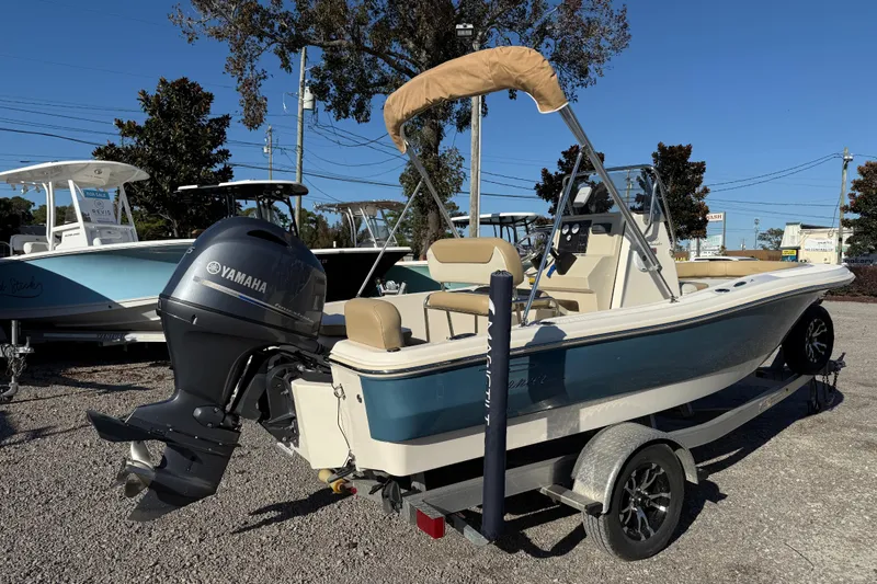 Slide: The Image of 2016 Pioneer 180 Islander boat with Yamaha outboard motor on a trailer. - 4
