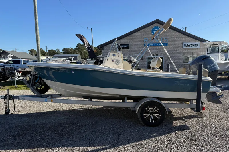Slide: The Image of 2016 Pioneer 180 Islander boat on trailer at dealership, side view. - 8