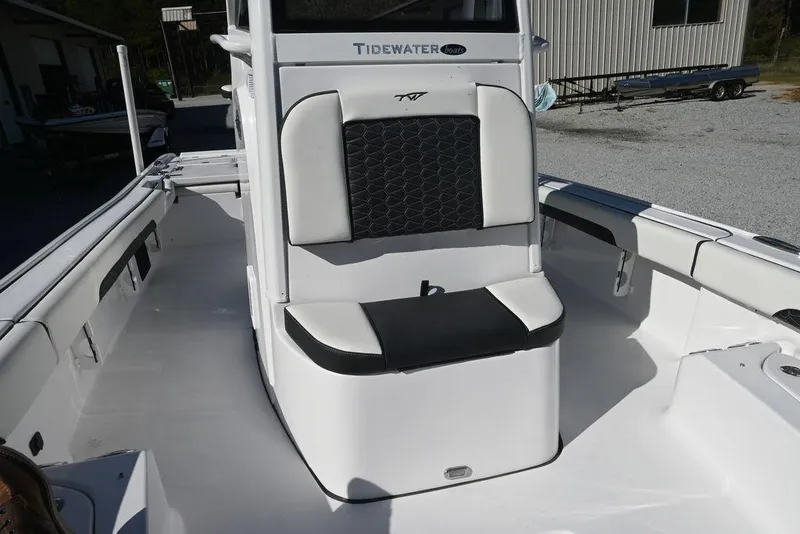 Slide: The Image of 2026 Tidewater 2500 Carolina Bay boat interior with cushioned seating and sleek design. - 14