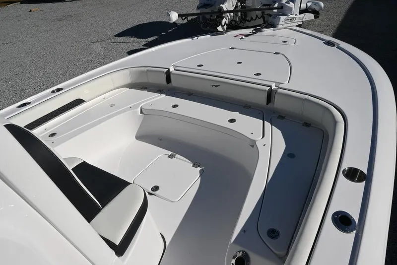 Slide: The Image of 2026 Tidewater 2500 Carolina Bay boat interior with seating and storage compartments. - 15