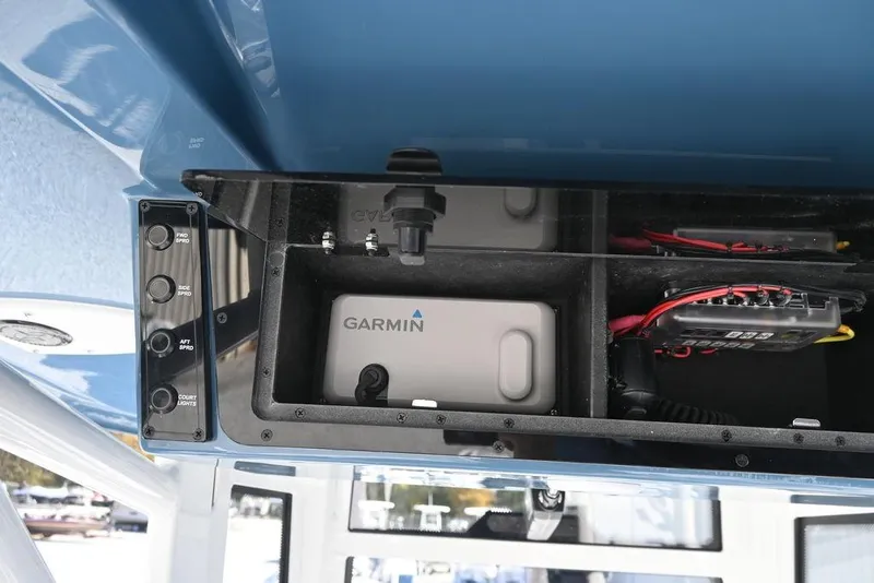 Slide: The Image of Control panel and Garmin device on 2026 Tidewater 2500 Carolina Bay boat. - 16