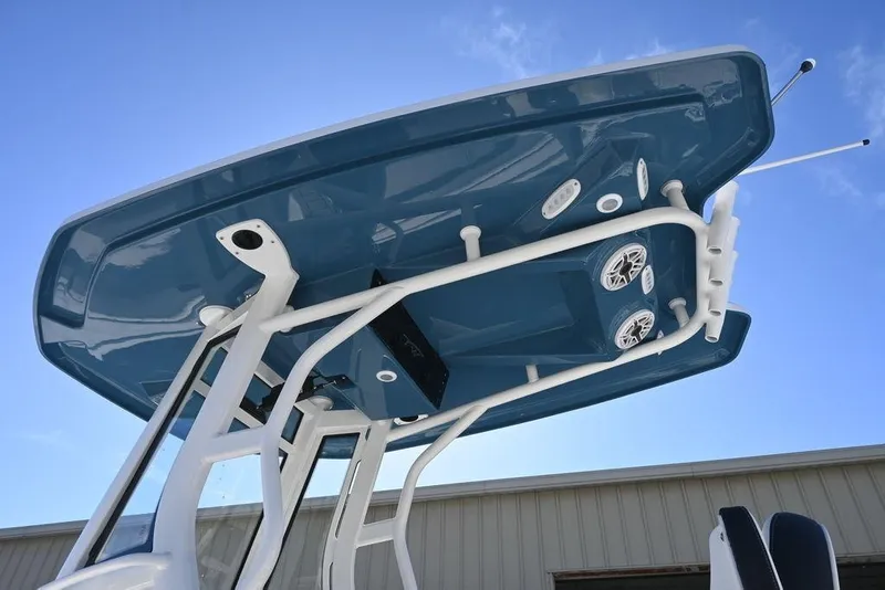Slide: The Image of Tidewater 2500 Carolina Bay 2026 boat T-top with speakers against blue sky. - 4