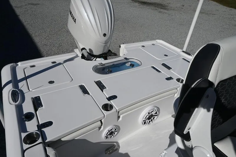 Slide: The Image of 2026 Tidewater 2500 Carolina Bay boat interior with Yamaha engine, featuring storage compartments and seating. - 9