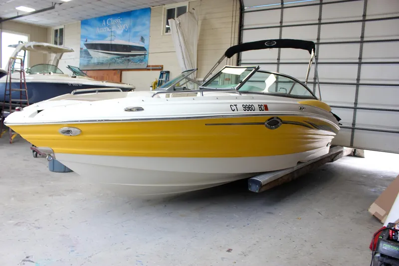 The Image of Yellow 2007 Azure AZ228 boat in a garage setting. - 0