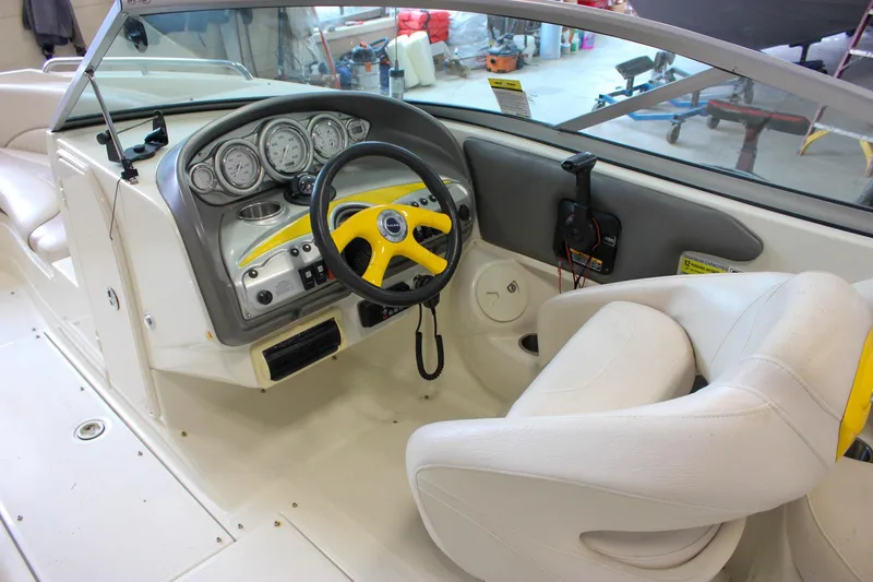 Slide: The Image of Interior of a 2007 Azure AZ228 boat with steering wheel and dashboard controls. - 17