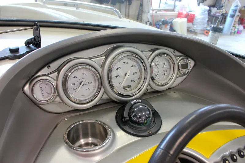 Slide: The Image of Dashboard of a 2007 Azure AZ228 boat with gauges and compass. - 20
