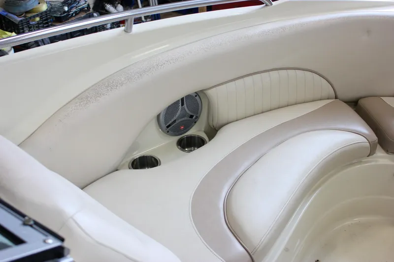 Slide: The Image of 2007 Azure AZ228 boat interior with beige seating and built-in cup holders. - 23