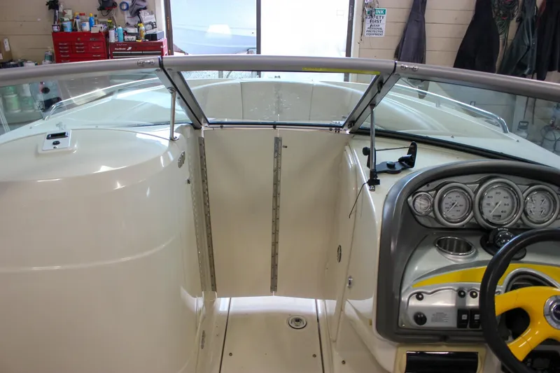 Slide: The Image of Interior view of a 2007 Azure AZ228 boat dashboard and steering wheel. - 27