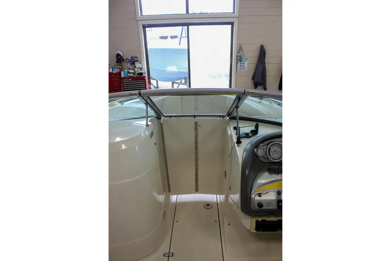 Slide: The Image of Interior view of a 2007 Azure AZ228 boat, showcasing dashboard and seating area. - 28