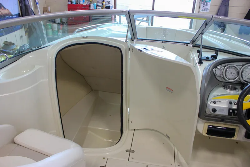 Slide: The Image of 2007 Azure AZ228 boat interior with open cabin door and dashboard view. - 29