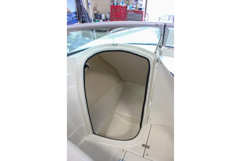 Slide: The Image of 2007 Azure AZ228 boat storage compartment with open hatch, showcasing interior space. - 30