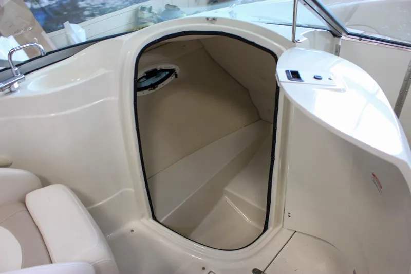 Slide: The Image of Interior cabin of 2007 Azure AZ228 boat, featuring sleek white design and compact space. - 31