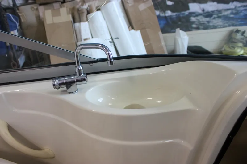 Slide: The Image of 2007 Azure AZ228 boat sink with chrome faucet in a workshop setting. - 32