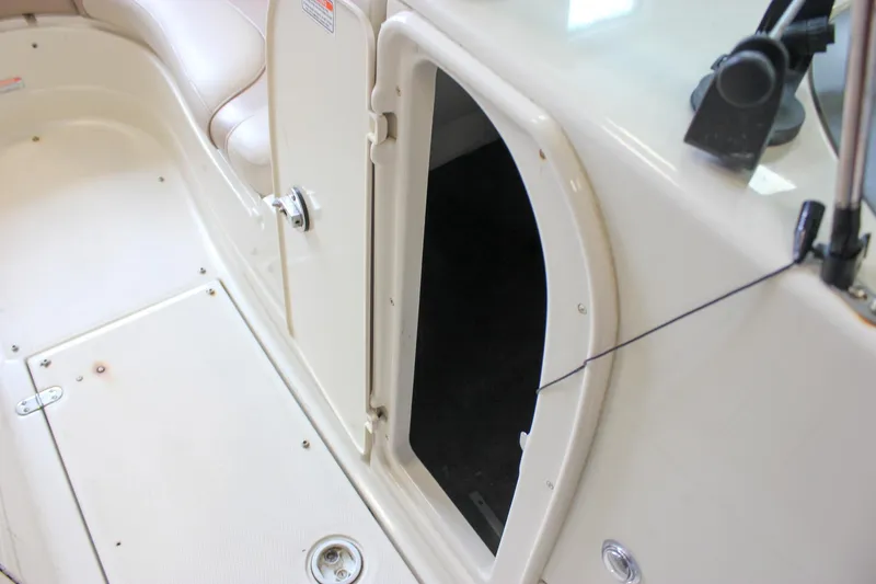 Slide: The Image of 2007 Azure AZ228 boat interior with open storage compartment and seating area. - 34