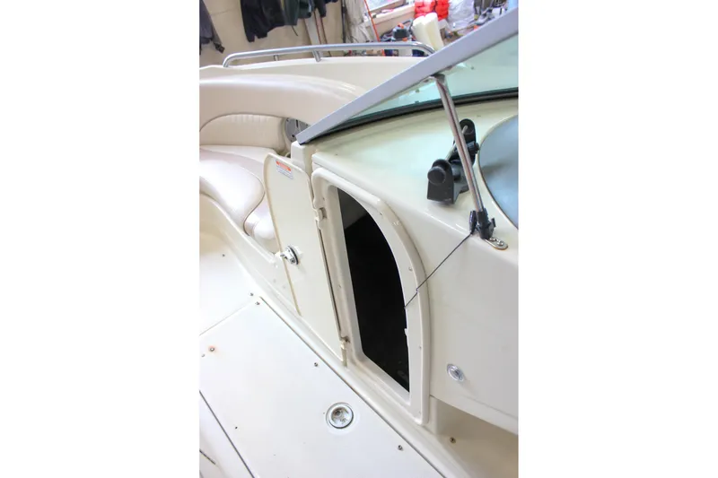Slide: The Image of Interior view of a 2007 Azure AZ228 boat, featuring seating and storage compartment. - 35