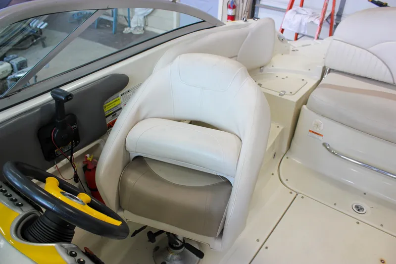Slide: The Image of Interior of 2007 Azure AZ228 boat with steering wheel and seating. - 36