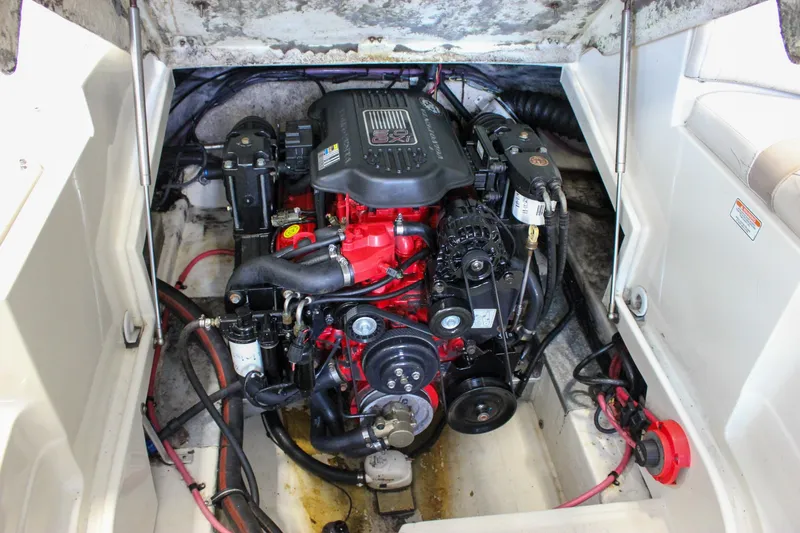 Slide: The Image of Engine compartment of a 2007 Azure AZ228 boat, featuring a detailed view of the engine. - 5