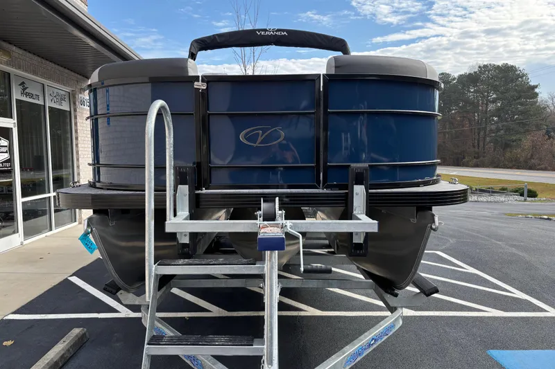Slide: The Image of 2026 Veranda Relax VR22RC pontoon boat displayed outdoors. - 1