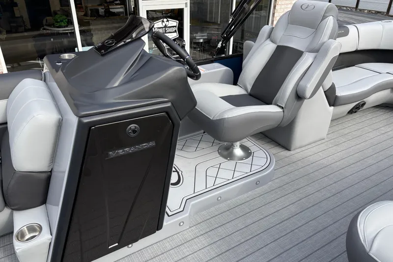 Slide: The Image of 2026 Veranda Relax VR22RC boat interior with sleek captain's chair and modern console design. - 7
