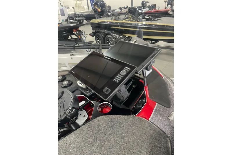 Slide: The Image of 2022 Skeeter FXR20 Apex boat dashboard with dual electronic displays. - 13