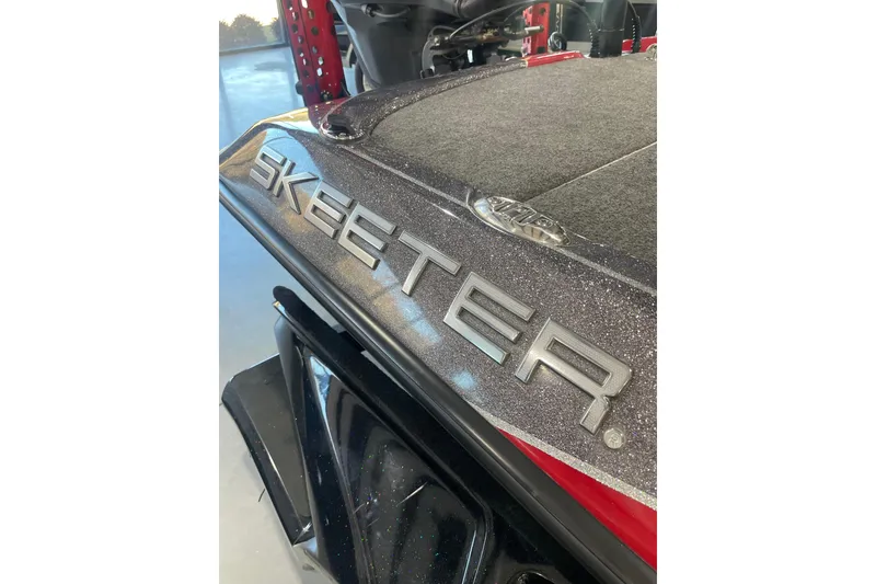 Slide: The Image of 2022 Skeeter FXR20 Apex boat with metallic finish and logo detail. - 17
