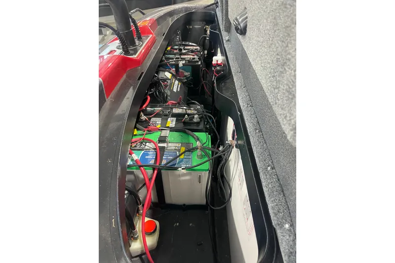 Slide: The Image of 2022 Skeeter FXR20 Apex boat battery compartment with wiring and components. - 21