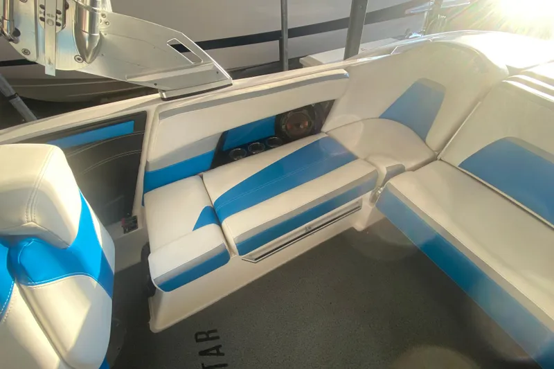 Slide: The Image of 2019 MasterCraft XStar interior with blue and white seating, showcasing modern design and comfort. - 12