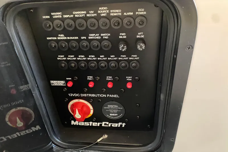 Slide: The Image of Control panel of a 2019 MasterCraft XStar boat, featuring various switches and indicators. - 16