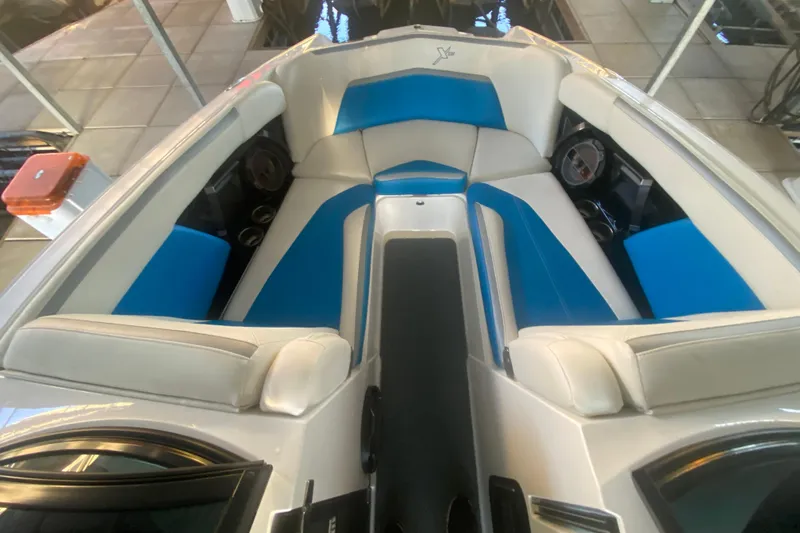 Slide: The Image of 2019 MasterCraft XStar boat interior with blue and white seating. - 22