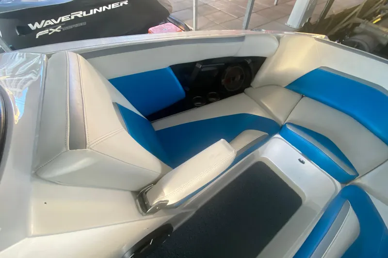 Slide: The Image of 2019 MasterCraft XStar interior with blue and white seating, showcasing luxury boat design. - 23