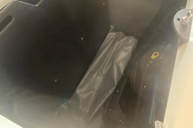 Slide: The Image of Storage compartment of a 2019 MasterCraft XStar boat, featuring interior details. - 28