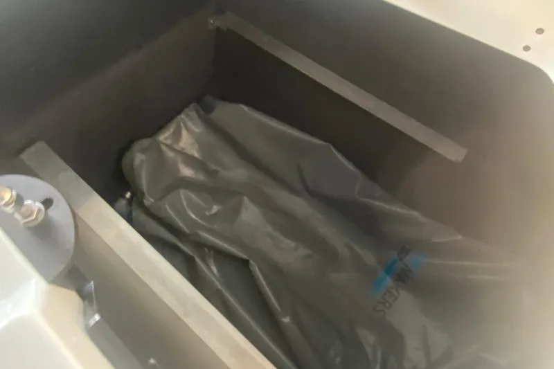 Slide: The Image of 2019 MasterCraft XStar ballast compartment with gray bag inside. - 29