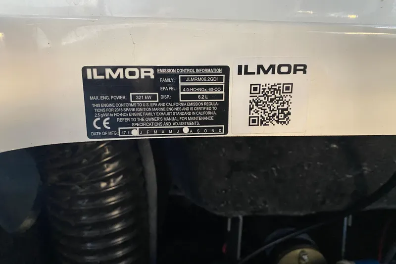 Slide: The Image of 2019 MasterCraft XStar engine label with Ilmor emission control details and QR code. - 30
