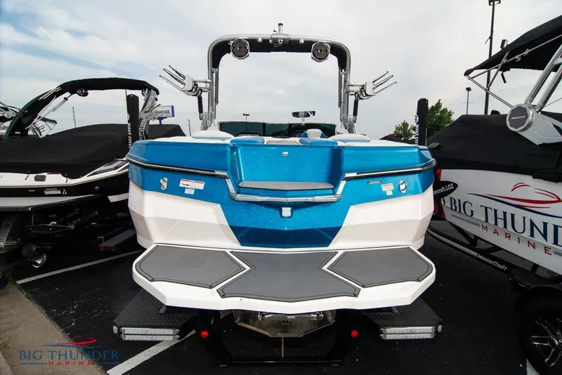 Slide: The Image of 2019 MasterCraft XStar boat in blue and white at Big Thunder Marine. - 39