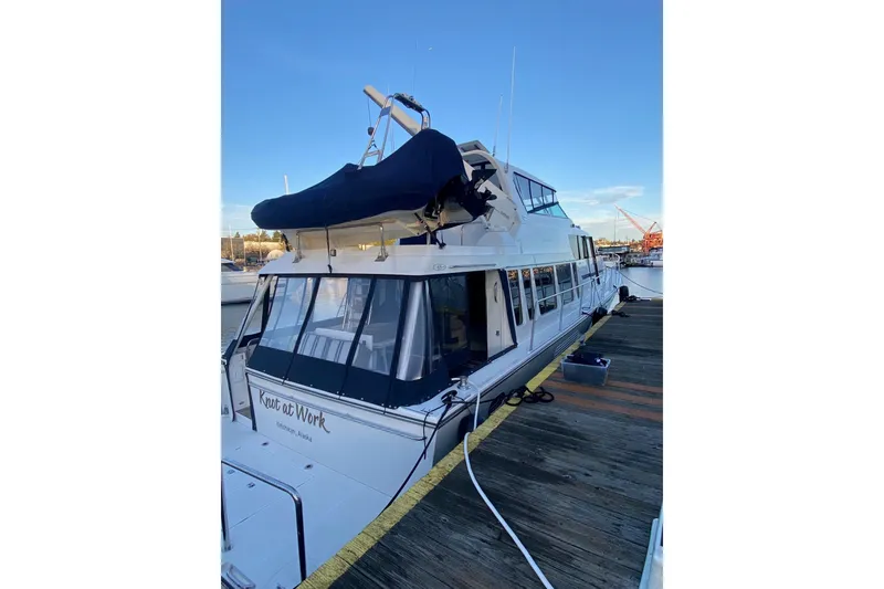 Slide: The Image of 2005 Pacific Mariner 65 Diamond yacht cruising on a scenic waterfront. - 2