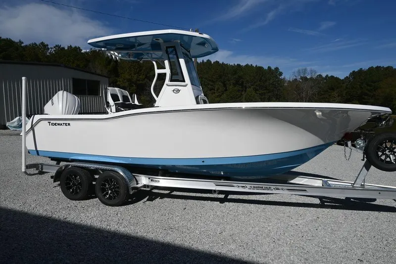 The Image of 2026 Tidewater 232 CC Adventure boat on trailer, side view, outdoors. - 1