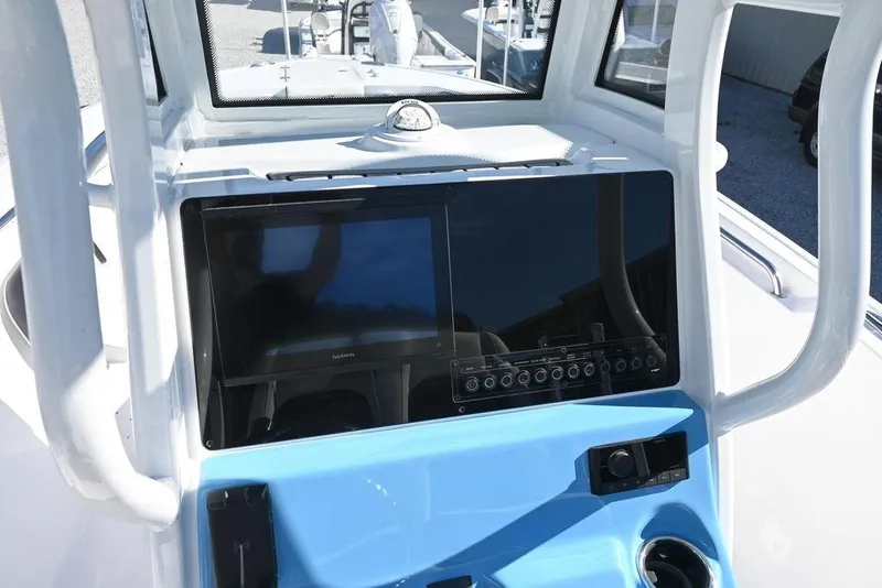 Slide: The Image of 2026 Tidewater 232 CC Adventure boat dashboard with modern navigation system. - 12