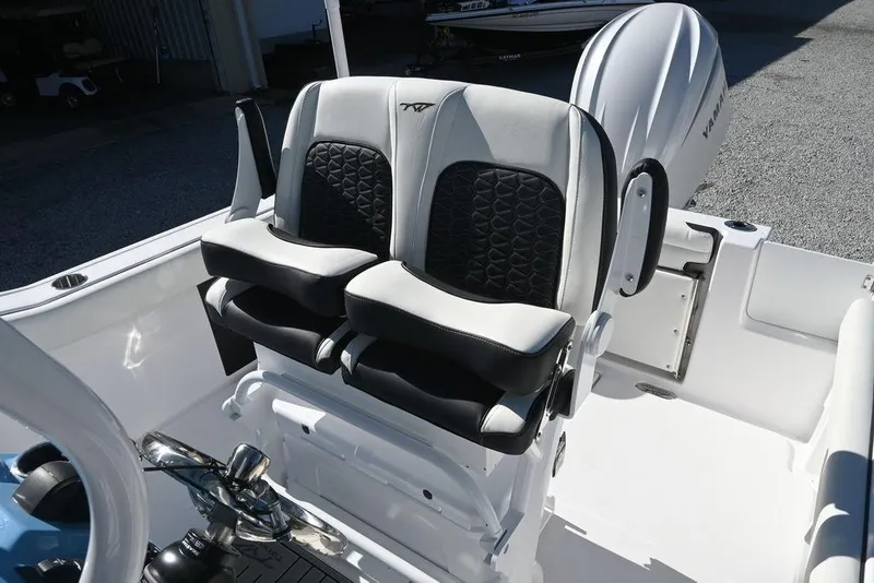 Slide: The Image of 2026 Tidewater 232 CC Adventure boat seats with stylish black and white design. - 14