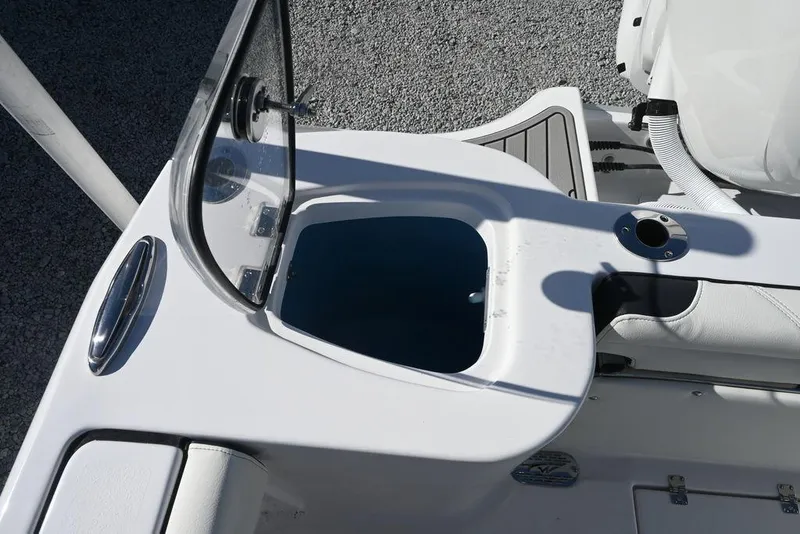 Slide: The Image of Tidewater 232 CC Adventure 2026 boat console with storage compartment and seating. - 17