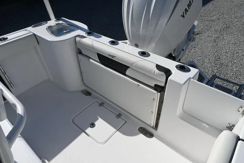 Slide: The Image of 2026 Tidewater 232 CC Adventure boat interior with Yamaha engine, featuring seating and storage. - 18