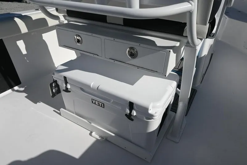 Slide: The Image of 2026 Tidewater 232 CC Adventure boat interior with Yeti cooler and storage compartments. - 19