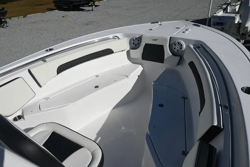 Slide: The Image of 2026 Tidewater 232 CC Adventure boat interior with seating and speakers. - 25