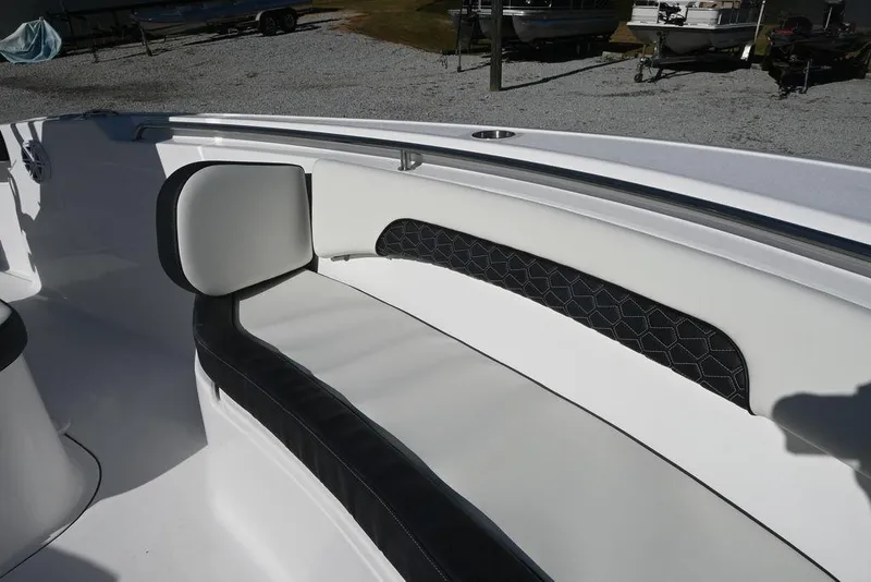Slide: The Image of 2026 Tidewater 232 CC Adventure boat interior with cushioned seating and sleek design. - 26