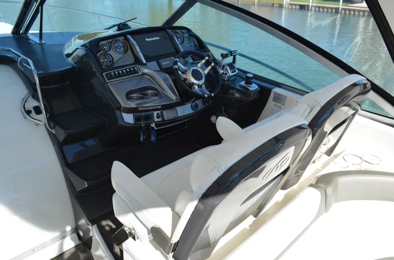 Slide: The Image of Cockpit of 2013 Monterey 340 Sport Yacht with modern controls and dual seating. - 12