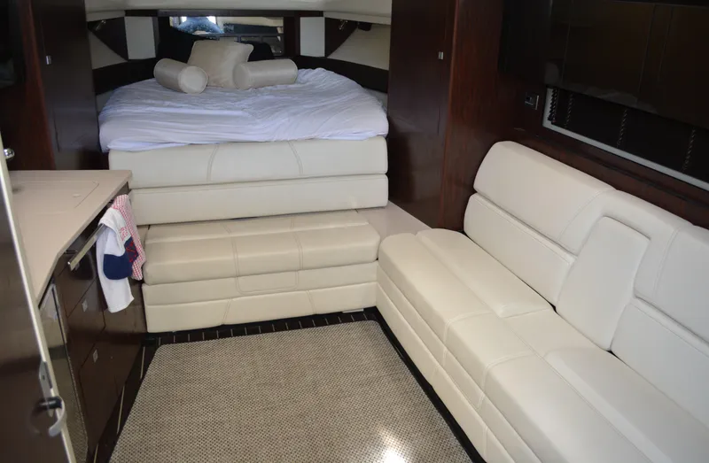 Slide: The Image of Luxurious interior of 2013 Monterey 340 Sport Yacht with plush seating and cozy bed. - 14