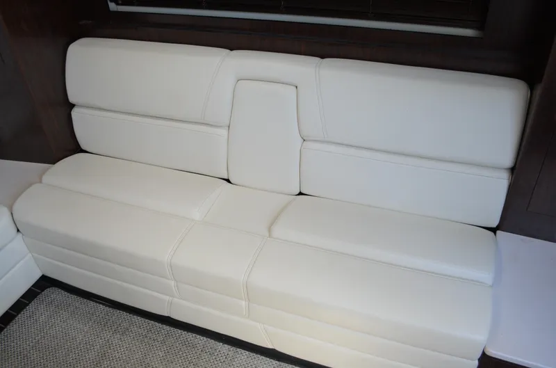 Slide: The Image of Luxurious white leather seating in a 2013 Monterey 340 Sport Yacht interior. - 15