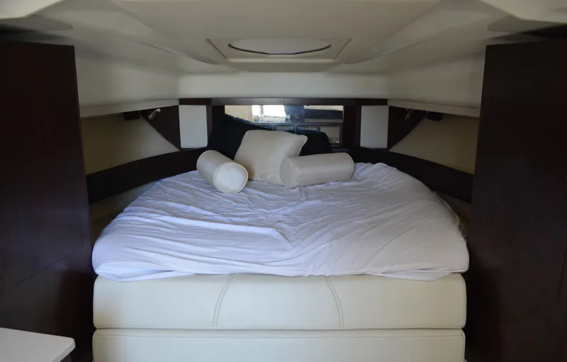 Slide: The Image of Luxurious cabin interior of 2013 Monterey 340 Sport Yacht with cozy bedding. - 18