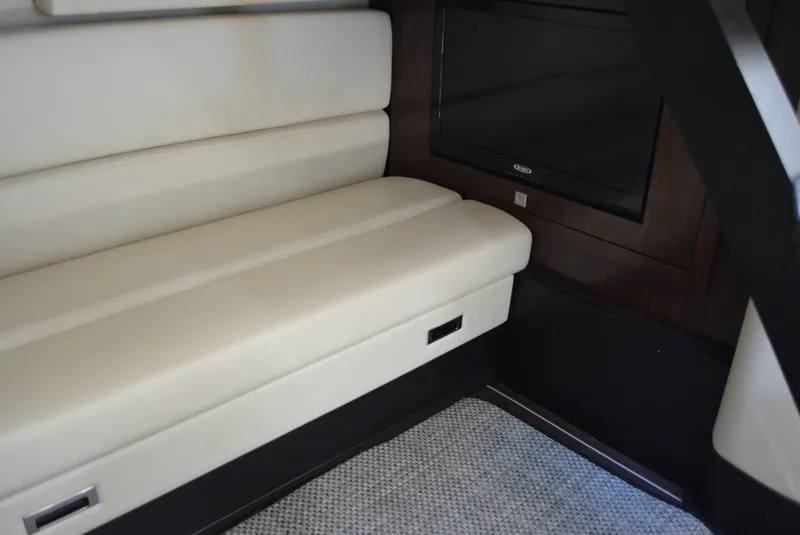 Slide: The Image of Interior of 2013 Monterey 340 Sport Yacht with beige seating and dark wood accents. - 23
